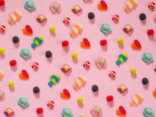Jelly candies pattern on pink background