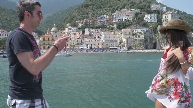 4K boyfriend taking piture of his girlfriend over Amalfi coast
