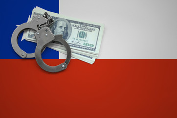 Chile flag  with handcuffs and a bundle of dollars. The concept of breaking the law and thieves...