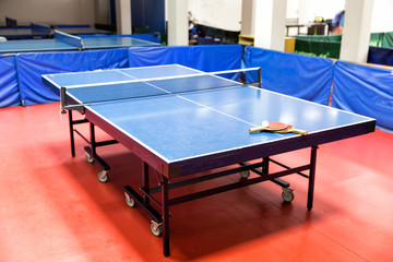 Blue ping pong tables in the gym