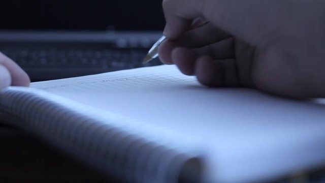 handwriting on notebook, close up lowlight.