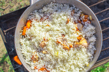 pilaf from chicken in cauldron