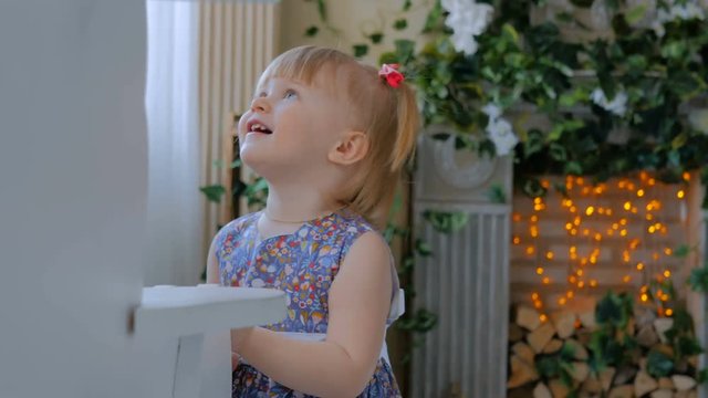 Little girl playing with white wooden rocking horse. Family, childhood, game and leisure concept