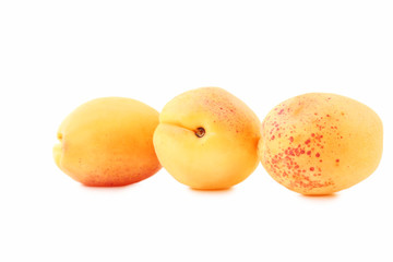 Ripe apricots isolated on white background