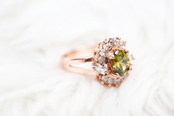 Green gem stone and diamond on pink gold ring