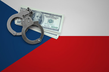 Czech flag  with handcuffs and a bundle of dollars. The concept of breaking the law and thieves...