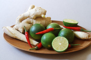 Set of asian spices: kaffir limes, lemongrass, bird's eye chilis, ginger. Suitable for tom yum and hot pot making.