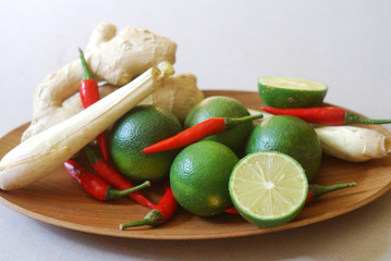 Set of asian spices: kaffir limes, lemongrass, bird's eye chilis, ginger. Suitable for tom yum and hot pot making.