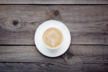 Cup of coffee on wooden table