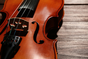 Violin on brown wooden table