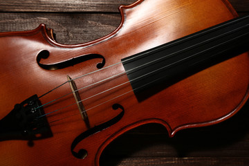 Violin on brown wooden table