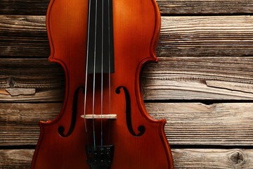 Violin on brown wooden table