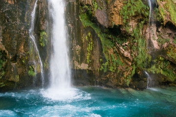 Fototapeta na wymiar Waterfall at the source of the river