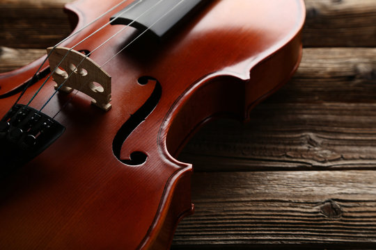 Violin on brown wooden table
