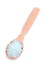 Sea salt in wooden spoon isolated on white