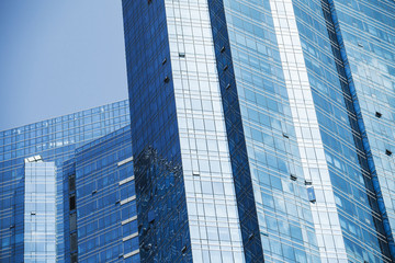Fototapeta na wymiar Office towers made of blue glass and steel
