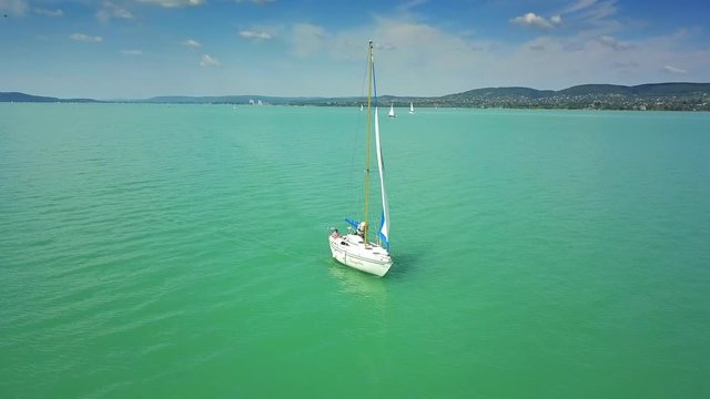 Lake Balaton, Hungary - 4K typical Hungarian sailboat sailing slowly on Lake Balaton on a summer morning