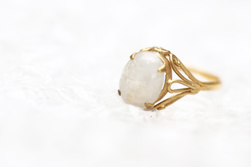 Opal white gem stone on gold ring
