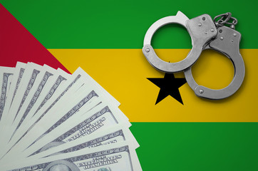 Sao Tome and Principe flag  with handcuffs and a bundle of dollars. The concept of illegal banking...