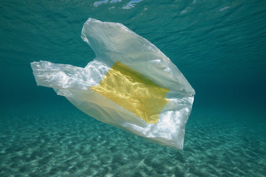 Underwater a plastic bag below water surface in the Mediterranean sea , Almeria, Andalusia, Spain
