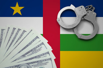 Central African Republic flag  with handcuffs and a bundle of dollars. The concept of illegal...