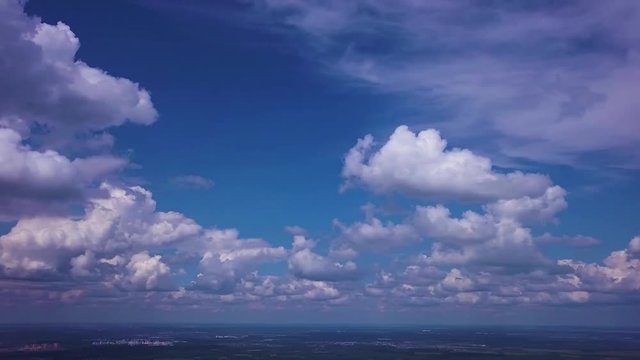 Panorama view from the top of tower. Summer sjy and clouds.
