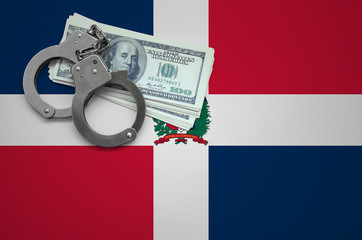 Dominican Republic flag  with handcuffs and a bundle of dollars. The concept of breaking the law...