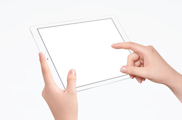 Female hands holding and touching empty screen of white tablet in horizontal position, isolated on...