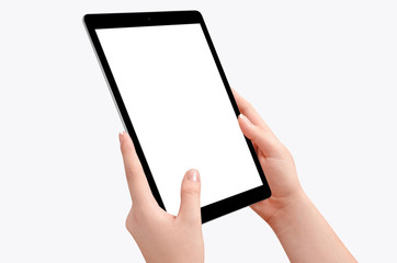 Female hands holding black tablet in vertical position isolated on white background. Empty screen for mockup design