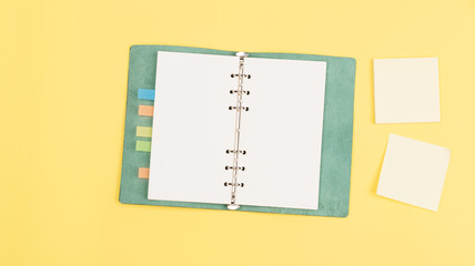 yellow sticky note and notebook