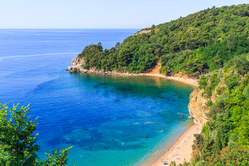 View from above on Adriatic sea coastline and Mogren beach at Montenegro, nature landscape, vacations to the summer paradise