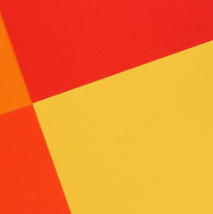 Abstract geometric paper background. Red, orange, yellow trend colors.Background pastel colors. Minimal concept. Flat lay, Top view. Copy space