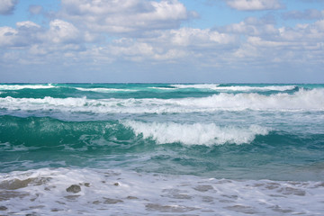 Beautiful background picture of turquoise waves crashing on the shore of Varadero, Cuba