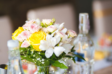 Wedding table decoration - fresh white and yellow flowers