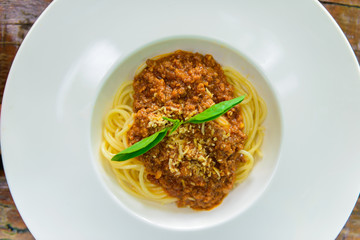 White Plate of delicious spaghetti Bolognaise or Bolognese with savory minced beef