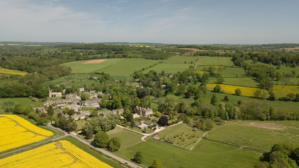 Aerial of yellow rapeseed fields on the Cotswold hills in England