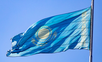 Flag of Kazakhstan against the blue sky