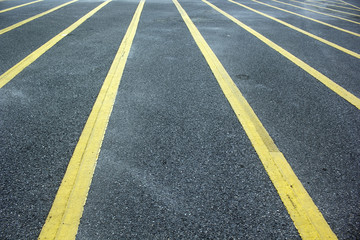 Yellow lines in the concrete road.