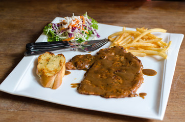 Grilled beef steak on plate