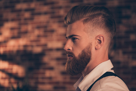 Half-faced close up side view portrait of handsome stunning virile masculine professional successful pensive serious focused attractive powerful authoritative gut wearing classic clothes copy-space