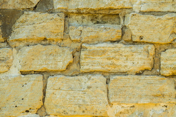 Stone wall pattern. Close up of big concrete bricks outside.