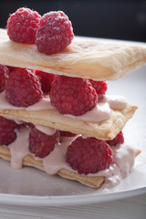 Raspberry mille feuille dessert on white background