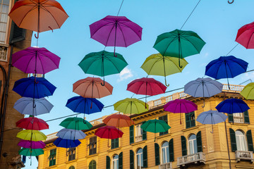 Fototapeta na wymiar Salita Santa Caterina, Genoa, colored umbrellas over the street