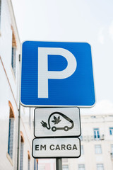 A special place in Lisbon in Portugal for refueling electric vehicles. Eco-friendly fuel. Parking and refueling signs with electric fuel