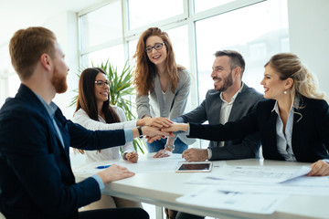 Successful company achieving goals with determined workers