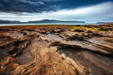 Sandy rocks formed by winds. Location Sudurland, cape Dyrholaey, Iceland, Europe.