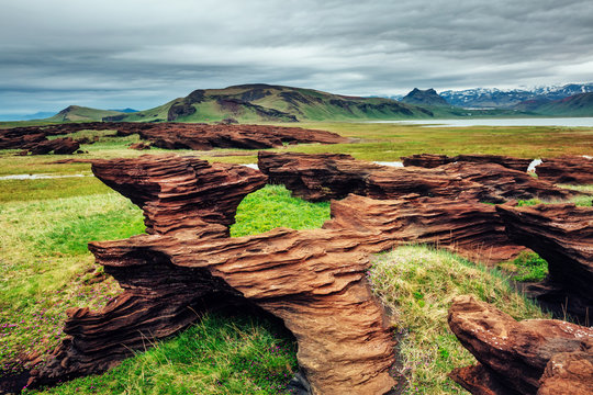 Sandy rocks formed by winds. Location Sudurland, cape Dyrholaey, Iceland, Europe.