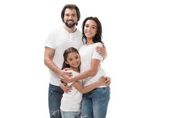 portrait of happy family in white shirts and jeans isolated on white
