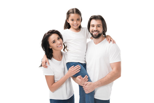 Portrait Of Happy Family In White Shirts Looking At Camera Isolated On White