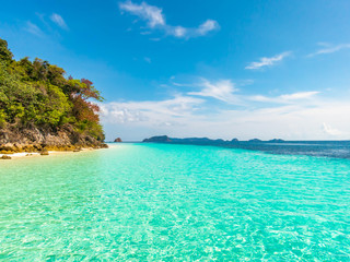 Wonderful seascape. Clear turquoise sea, forest mountain and blue sky.